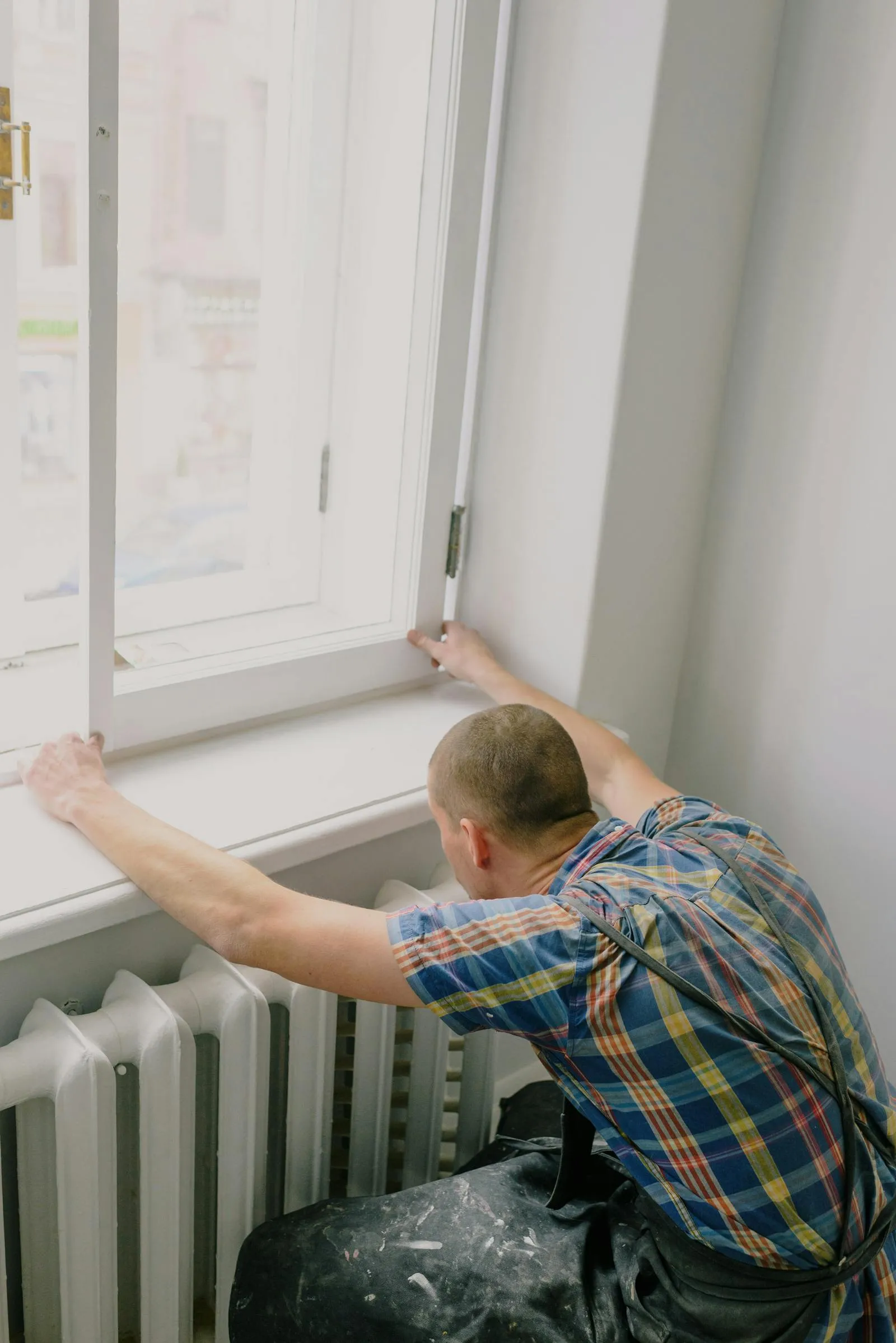 Contractor working on a window installation site